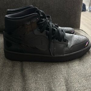 Black on black with patten leather trim Jordan 1